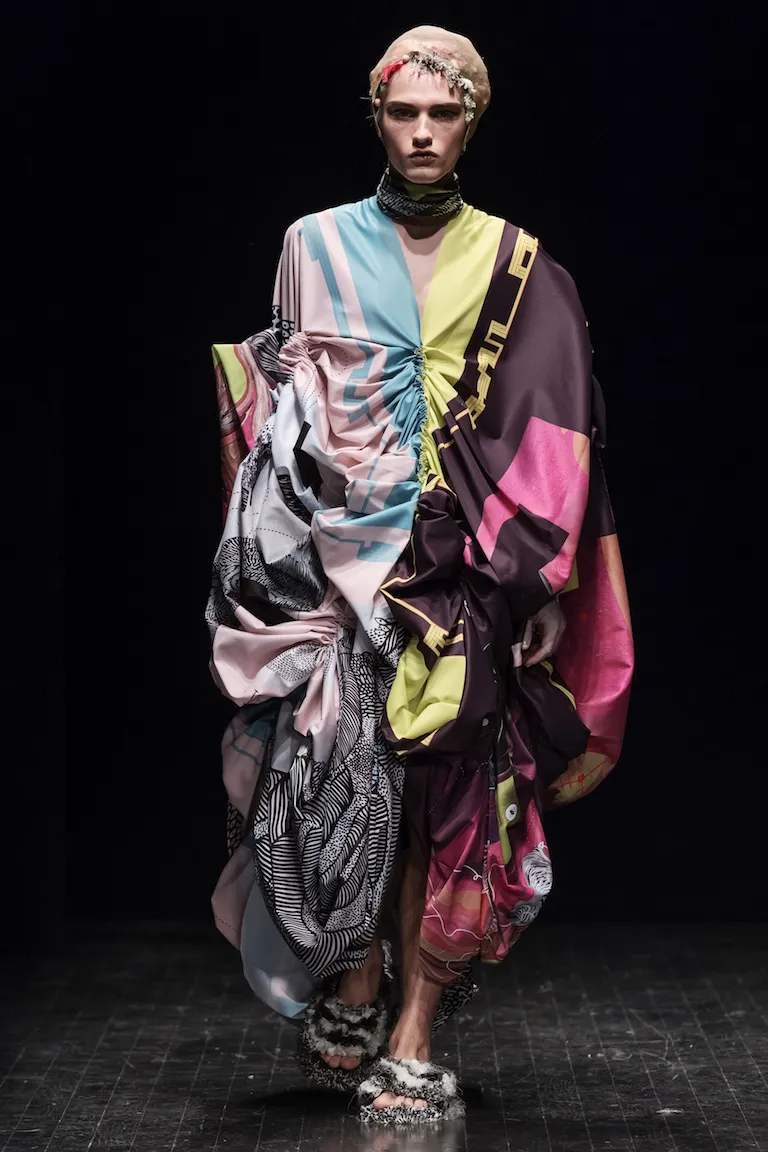 A gathered dress with large blocks of pink, light blue, lime and plum, and black-and-white patterned sections.